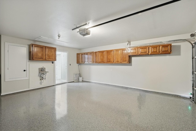 130 N Point Dr, Krum, TX 76249 - garage with a garage door opener and baseboards