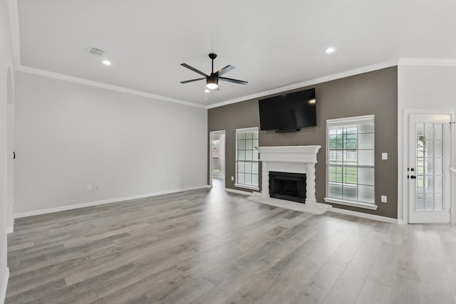 130 N Point Dr, Krum, TX 76249 - unfurnished living room featuring a ceiling fan, baseboards, a fireplace with raised hearth, wood finished floors, and crown molding