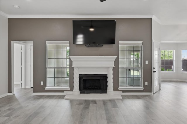 130 N Point Dr, Krum, TX 76249 - unfurnished living room featuring wood finished floors, baseboards, a fireplace with raised hearth, and ornamental molding
