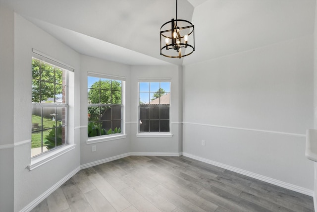 130 N Point Dr, Krum, TX 76249 - unfurnished dining area featuring a chandelier, wood finished floors, and plenty of natural light