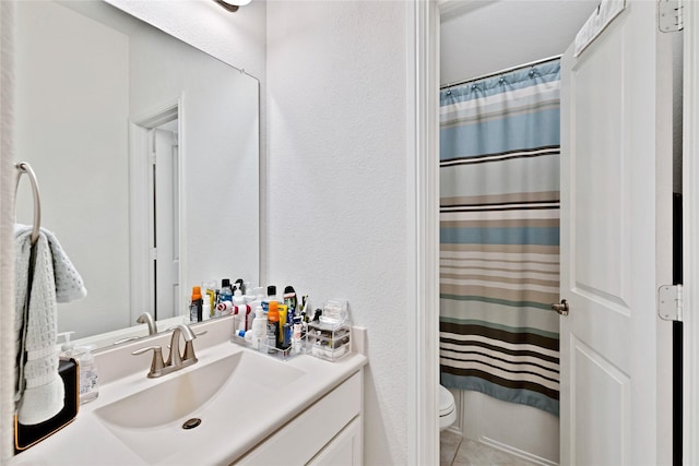 7244 Montosa Trl, Fort Worth, TX 76131 - full bathroom featuring vanity, a shower with shower curtain, tile patterned floors, and a textured wall