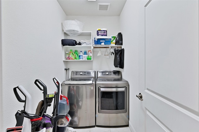 7244 Montosa Trl, Fort Worth, TX 76131 - laundry room featuring washing machine and clothes dryer and tile patterned flooring