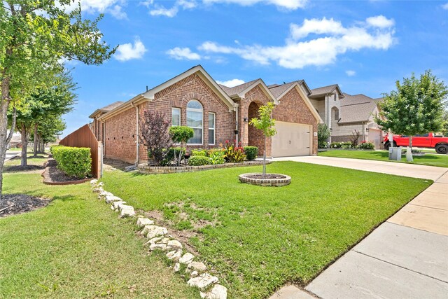 7244 Montosa Trl, Fort Worth, TX 76131 - view of front facade featuring brick siding, a front yard, concrete driveway, and an attached garage