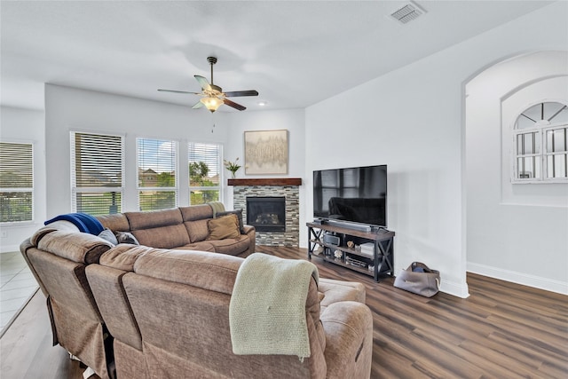 7244 Montosa Trl, Fort Worth, TX 76131 - living area featuring a ceiling fan, wood finished floors, arched walkways, a fireplace, and recessed lighting