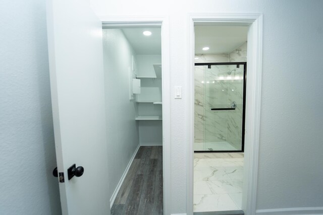 704 Vine St, Euless, TX 76040 - bathroom featuring a marble finish shower and baseboards