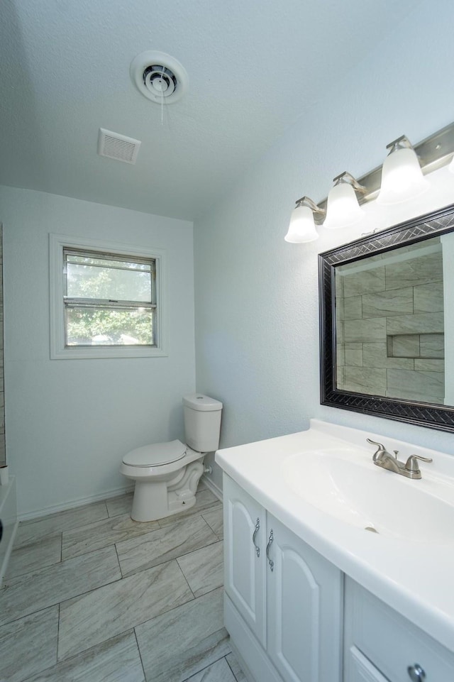 704 Vine St, Euless, TX 76040 - bathroom with vanity, toilet, baseboards, a bathtub, and a shower