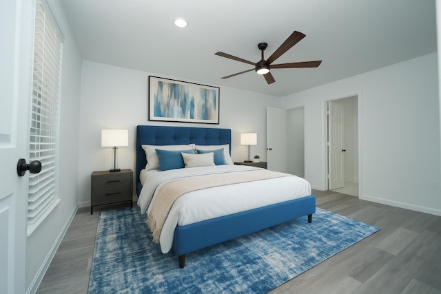 704 Vine St, Euless, TX 76040 - bedroom with wood finished floors, baseboards, and a ceiling fan