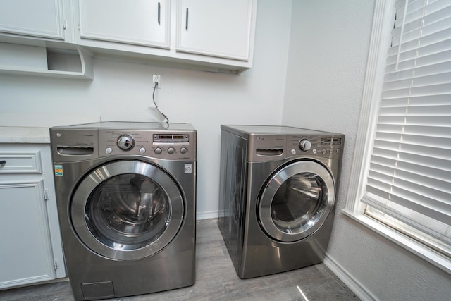704 Vine St, Euless, TX 76040 - washroom featuring washer and dryer, cabinet space, wood finished floors, and baseboards