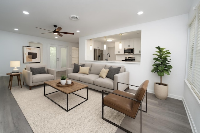 704 Vine St, Euless, TX 76040 - living room with wood finished floors, a ceiling fan, baseboards, and recessed lighting