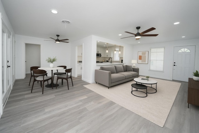 704 Vine St, Euless, TX 76040 - living area with a ceiling fan, baseboards, light wood finished floors, and recessed lighting