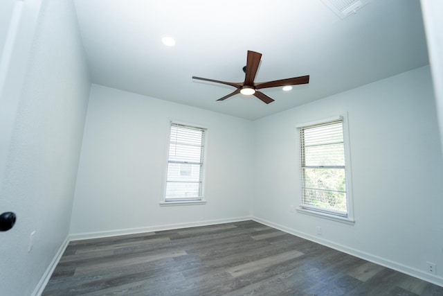 704 Vine St, Euless, TX 76040 - spare room with dark wood-style flooring, a ceiling fan, and baseboards