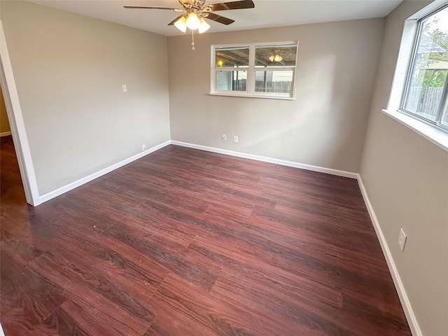5729 Blackmore Ave, Fort Worth, TX 76107 - empty room featuring dark wood finished floors, a ceiling fan, and baseboards