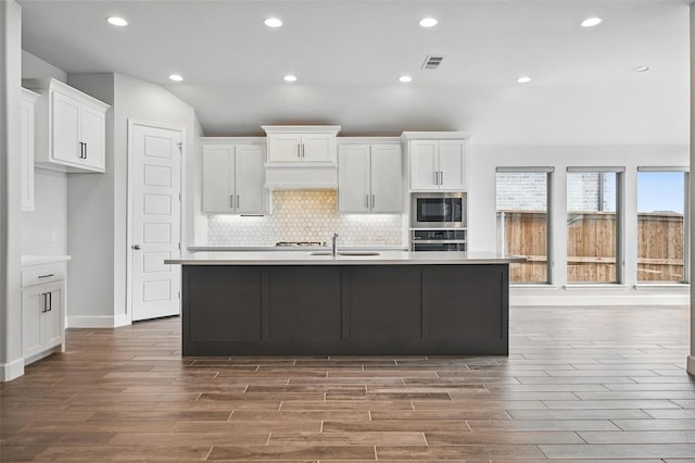 1419 Misty Pasture Way, Mansfield, TX 76063 - kitchen featuring wood finished floors, white cabinetry, appliances with stainless steel finishes, light countertops, and recessed lighting