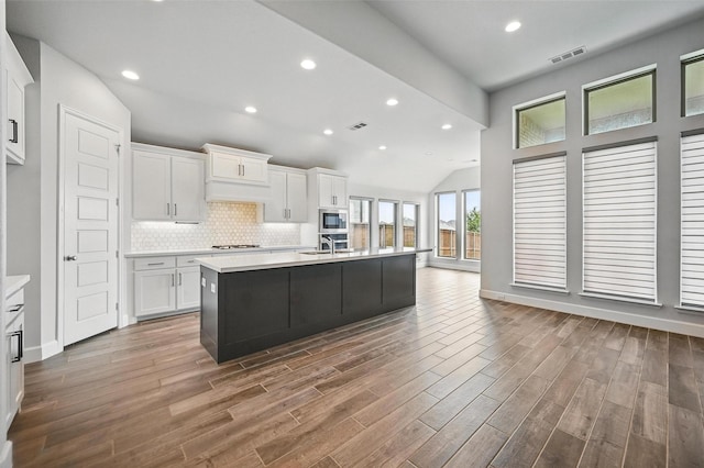 1419 Misty Pasture Way, Mansfield, TX 76063 - kitchen with a sink, light countertops, white cabinetry, lofted ceiling, and recessed lighting