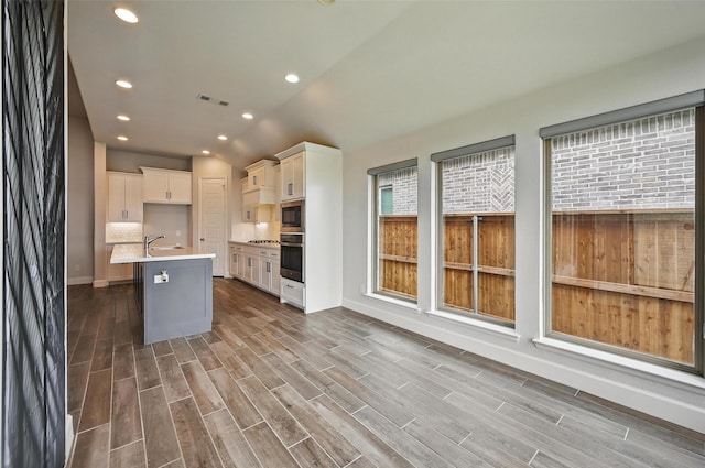 1419 Misty Pasture Way, Mansfield, TX 76063 - kitchen featuring appliances with stainless steel finishes, baseboards, wood finished floors, light countertops, and recessed lighting