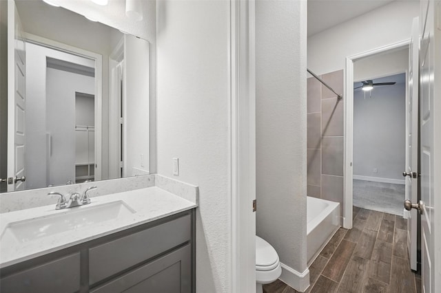 1419 Misty Pasture Way, Mansfield, TX 76063 - bathroom with vanity, wood finished floors, toilet, bathing tub / shower combination, and ceiling fan