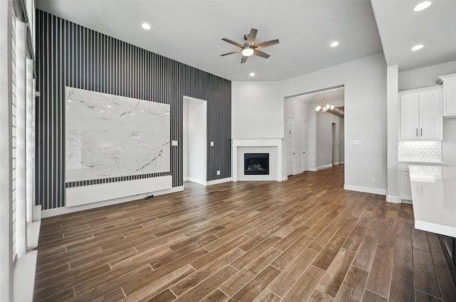 1419 Misty Pasture Way, Mansfield, TX 76063 - unfurnished living room with a ceiling fan, dark wood-style floors, a chandelier, baseboards, and recessed lighting