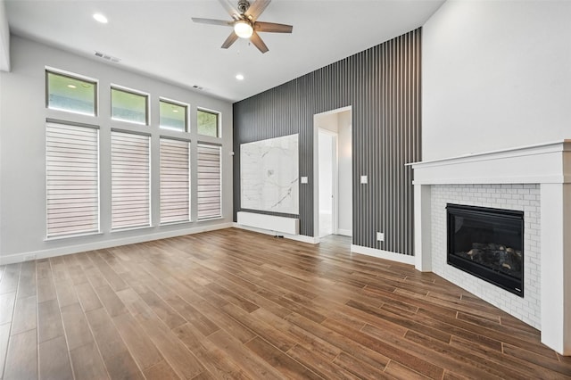 1419 Misty Pasture Way, Mansfield, TX 76063 - unfurnished living room with a ceiling fan, baseboards, wood finished floors, recessed lighting, and a brick fireplace