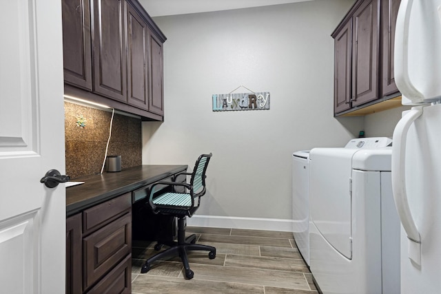 8217 American Way, Denton, TX 76207 - laundry room featuring cabinet space, separate washer and dryer, baseboards, wood finished floors, and a desk