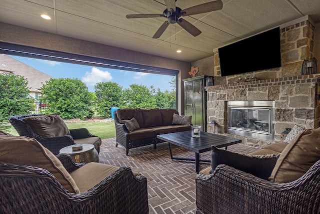 8217 American Way, Denton, TX 76207 - view of patio / terrace with an outdoor living space with a fireplace and ceiling fan
