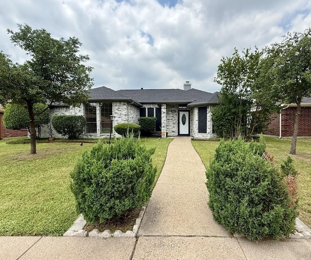 1001 Schrade Trl, Mesquite, TX 75181 - single story home with a front yard, a chimney, brick siding, and a shingled roof