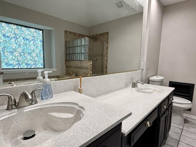 1001 Schrade Trl, Mesquite, TX 75181 - bathroom with toilet, double vanity, a shower stall, and tile patterned flooring