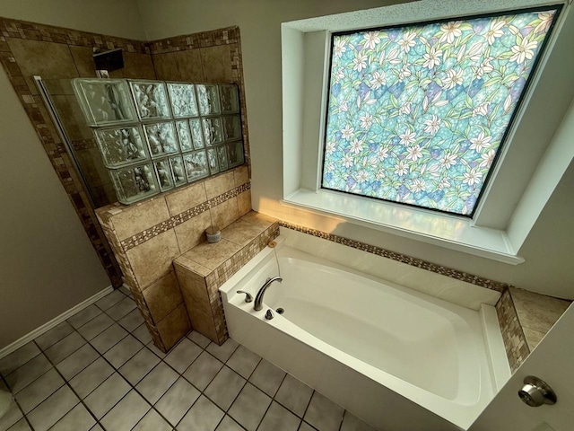 1001 Schrade Trl, Mesquite, TX 75181 - bathroom featuring a bath, a walk in shower, and tile patterned floors