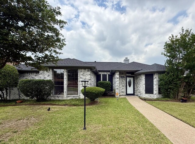 1001 Schrade Trl, Mesquite, TX 75181 - view of front of home featuring stone siding and a chimney