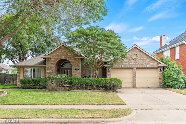 11200 Williamsburg Ln, Frisco, TX 75035 - traditional-style home with a garage, brick siding, and driveway