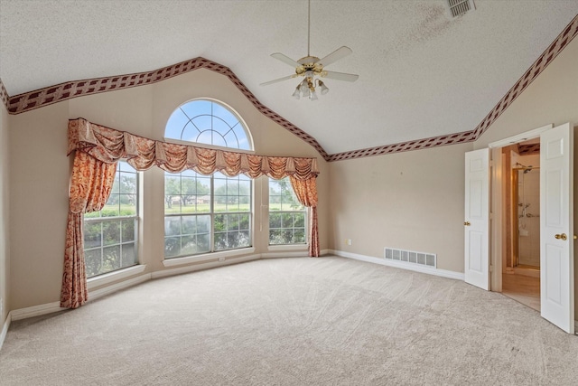 11200 Williamsburg Ln, Frisco, TX 75035 - carpeted empty room featuring a textured ceiling, a ceiling fan, baseboards, and high vaulted ceiling