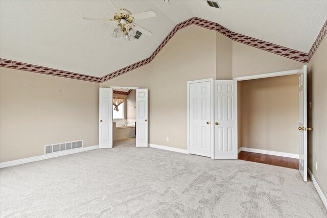 11200 Williamsburg Ln, Frisco, TX 75035 - unfurnished bedroom featuring carpet floors, high vaulted ceiling, ensuite bath, baseboards, and a ceiling fan