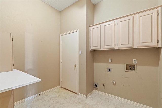 11200 Williamsburg Ln, Frisco, TX 75035 - laundry area featuring hookup for a gas dryer, cabinet space, washer hookup, baseboards, and hookup for an electric dryer