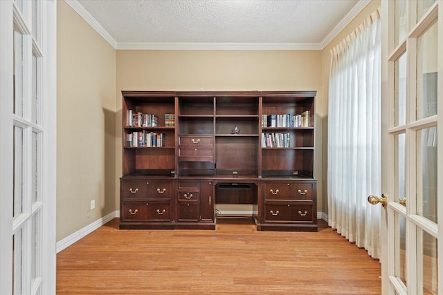 11200 Williamsburg Ln, Frisco, TX 75035 - unfurnished office featuring french doors, light wood finished floors, crown molding, baseboards, and a textured ceiling