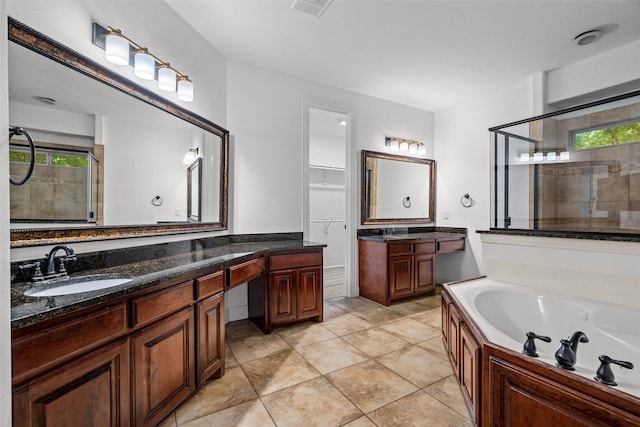 1228 Copano Dr, Allen, TX 75013 - bathroom featuring a bath, tiled shower, vanity, and tile patterned floors