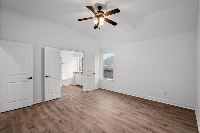 1228 Copano Dr, Allen, TX 75013 - unfurnished bedroom with light wood finished floors, baseboards, vaulted ceiling, ensuite bathroom, and a ceiling fan
