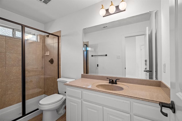 1228 Copano Dr, Allen, TX 75013 - bathroom featuring vanity, a stall shower, and toilet