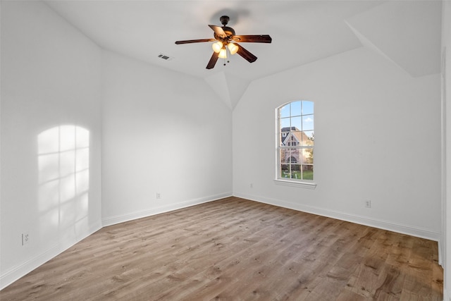 1228 Copano Dr, Allen, TX 75013 - empty room featuring a ceiling fan, wood finished floors, vaulted ceiling, and baseboards