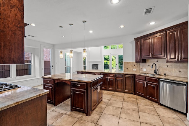 1228 Copano Dr, Allen, TX 75013 - kitchen featuring stainless steel dishwasher, a sink, decorative backsplash, recessed lighting, and dark brown cabinets