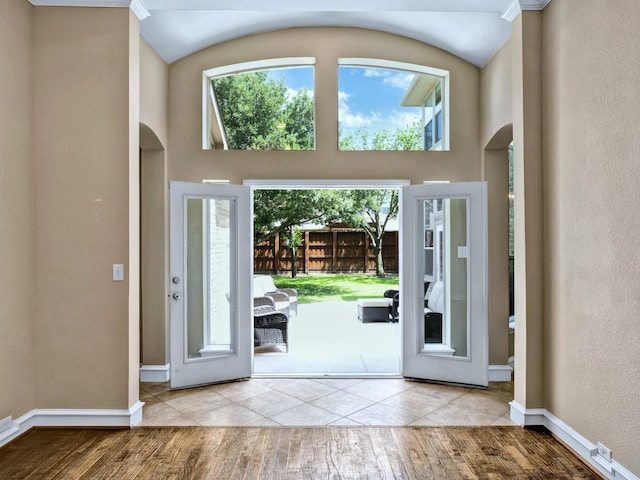 511 Cloud View Ct, Prosper, TX 75078 - foyer entrance with arched walkways, plenty of natural light, wood finished floors, and a high ceiling