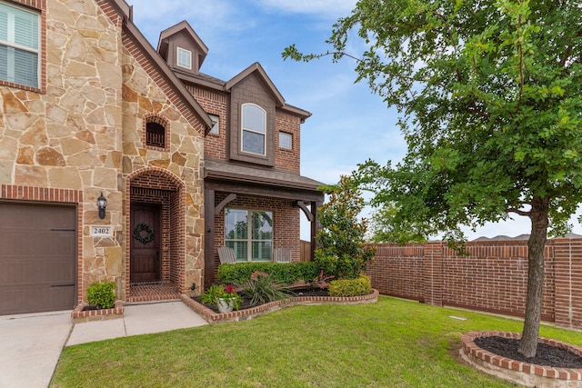 2402 Wilson Dr, Anna, TX 75409 - view of front of home with stone siding, a garage, and brick siding