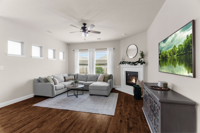 2402 Wilson Dr, Anna, TX 75409 - living room featuring a ceiling fan, a glass covered fireplace, and dark wood-style flooring