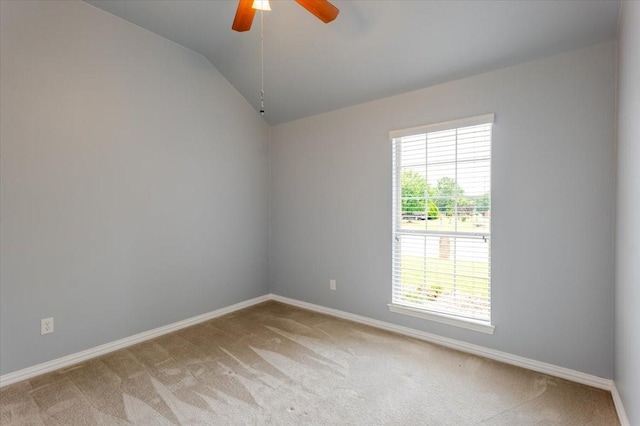 316 Cottonwood Trl, Shady Shores, TX 76208 - spare room featuring light colored carpet, lofted ceiling, a ceiling fan, and baseboards