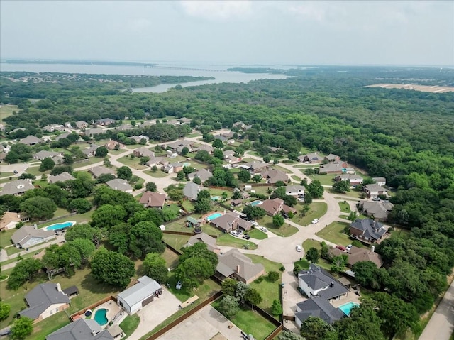 316 Cottonwood Trl, Shady Shores, TX 76208 - aerial perspective of suburban area with a heavily wooded area and a nearby body of water
