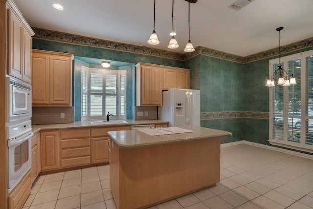 9 Park Place Ct, Wichita Falls, TX 76302 - kitchen with white appliances, a sink, wallpapered walls, light tile patterned flooring, and light brown cabinets