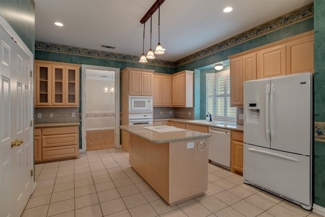 9 Park Place Ct, Wichita Falls, TX 76302 - kitchen with white appliances, wallpapered walls, light brown cabinetry, light countertops, and light tile patterned floors
