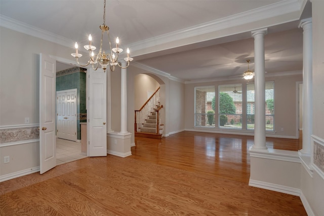 9 Park Place Ct, Wichita Falls, TX 76302 - unfurnished room with wood finished floors, ornamental molding, arched walkways, a chandelier, and ceiling fan