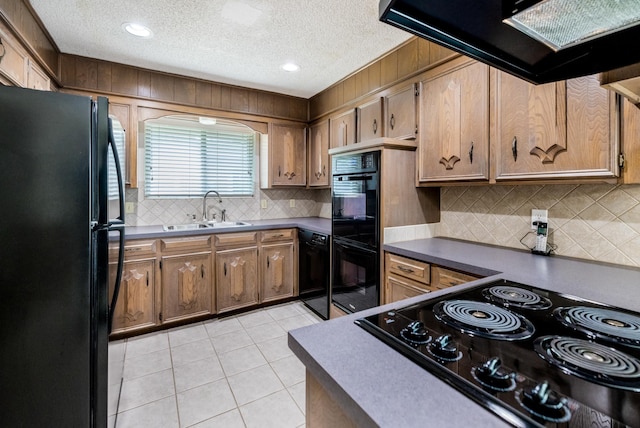 4508 Ramsgate Ct, Arlington, TX 76013 - kitchen featuring black appliances, a sink, extractor fan, light tile patterned floors, and backsplash