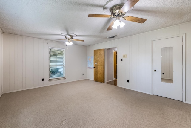4508 Ramsgate Ct, Arlington, TX 76013 - unfurnished bedroom featuring carpet floors, a textured ceiling, and a ceiling fan
