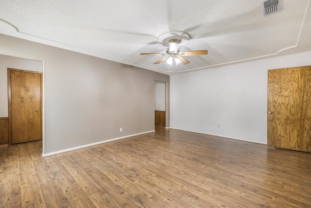 4508 Ramsgate Ct, Arlington, TX 76013 - empty room featuring a ceiling fan, wood finished floors, and a textured ceiling