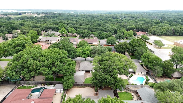 4508 Ramsgate Ct, Arlington, TX 76013 - aerial perspective of suburban area with a pool area and a heavily wooded area